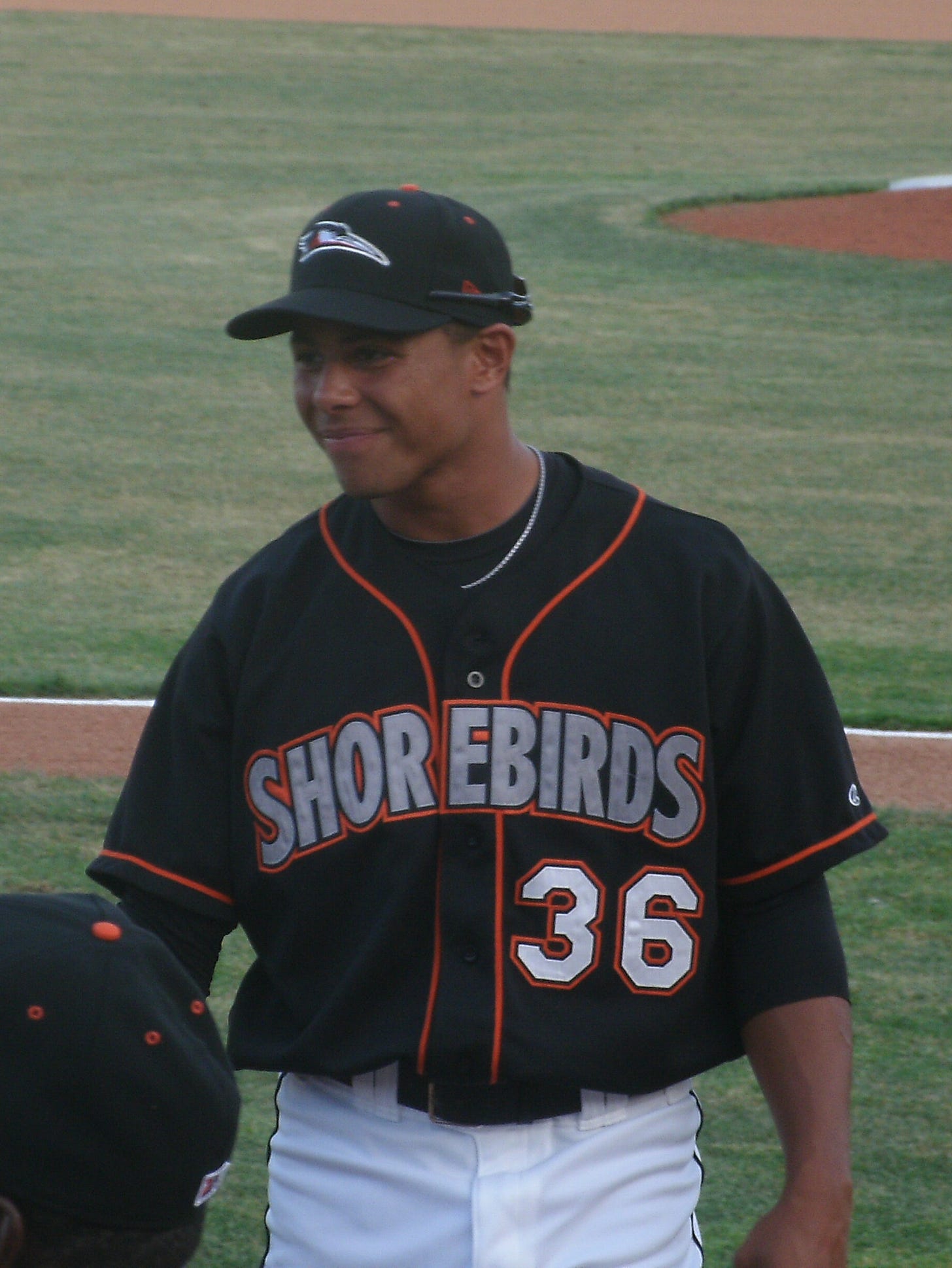 Steve Bumbry shares a smile with some of his new teammates in this photo taken before an April 6 exhibition game.