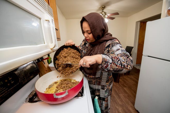 Zafreen Chowdhury prepares an order of samosa with shredded beef and ghost peppers in her Sterling Heights home, March 31, 2022. Chowdhury, a Bangladeshi immigrant, expects to be busy preparing orders throughout the Muslim holy month of Ramadan.