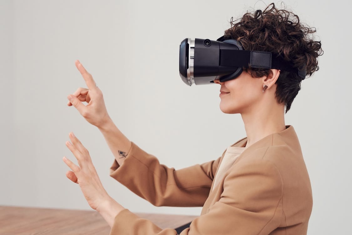 Free Woman Using Virtual Reality Goggles Stock Photo