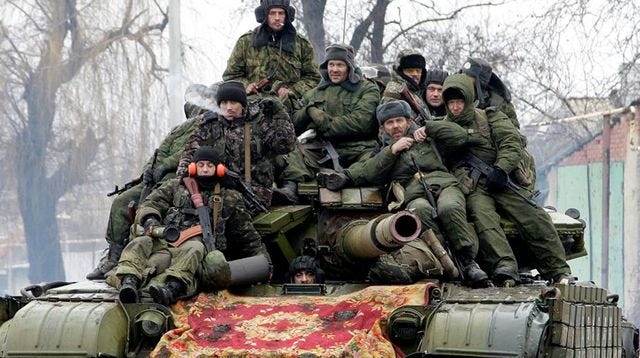 members-of-the-armed-forces-of-the-separatist-self-proclaimed-donetsk-people-s-republic-drive-a-tank-on-the-outskirts-of-donetsk_5193357.jpg (640×358)