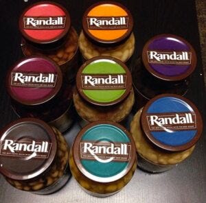Picture of jars with colorful lids saying Randall