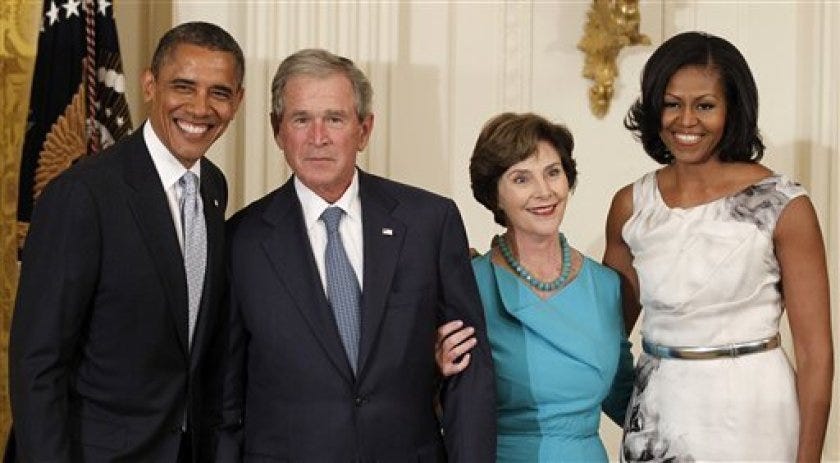From left, President Barack Obama, former President George W. Bush, former first lay Laura Bush and first lady Michelle Obama, pose in the East Room of the White House in Washington, Thursday, May 31, 2012, during a ceremony to unveil the Bush portraits. (AP Photo/Pablo Martinez Monsivais)