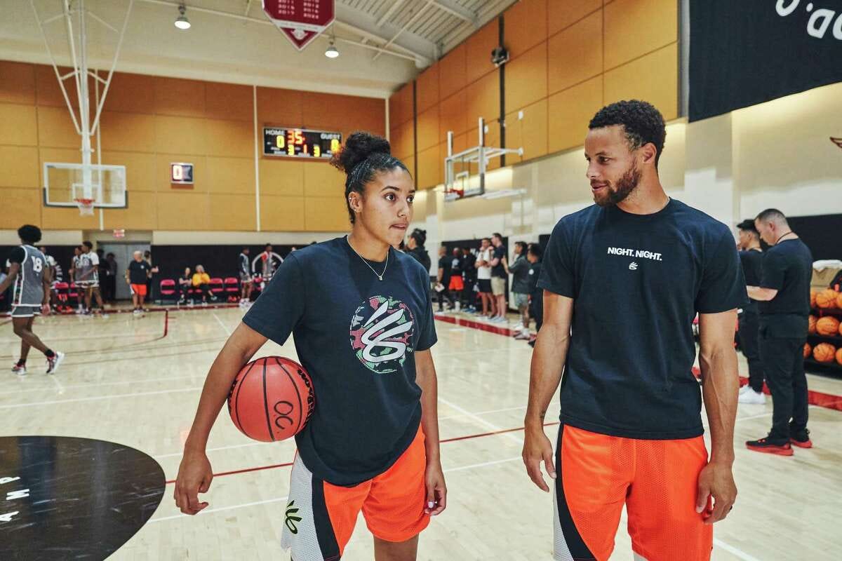 Azzi Fudd talks with Golden State Warriors point guard Stephen Curry during Curry Camp at the San Francisco Olympic Club in San Francisco, Calif. on Thursday, Aug. 4, 2022.