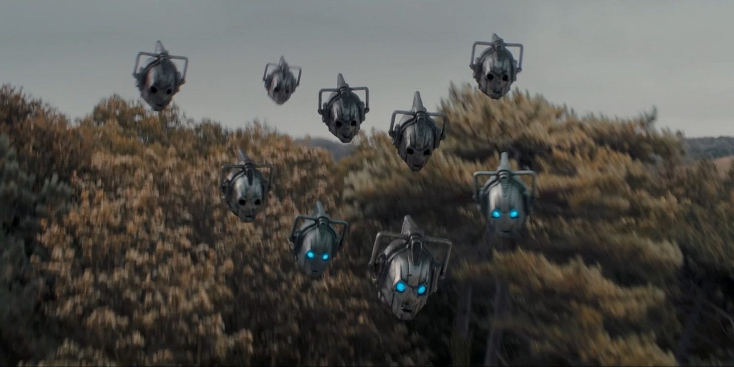 This image shows nine Cyberdrones (Cyberman heads) flying above trees as they swoop in to attack humanity's last remaining settlement.