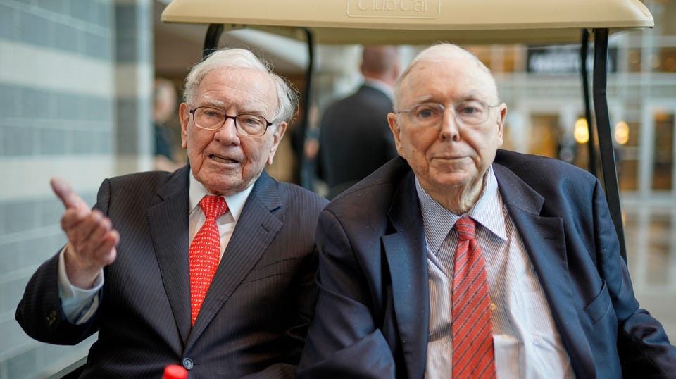 Berkshire Hathaway Chairman and CEO Warren Buffett, left, and Vice Chairman Charlie Munger, briefly chat with reporters Friday, May 3, 2019, one day before Berkshire Hathaway's annual shareholders meeting.