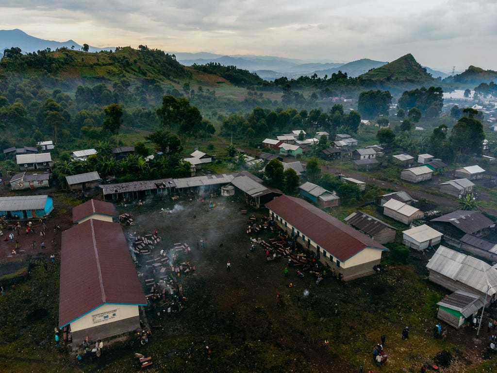 Newly displaced families seeking shelter in a school in Munigi