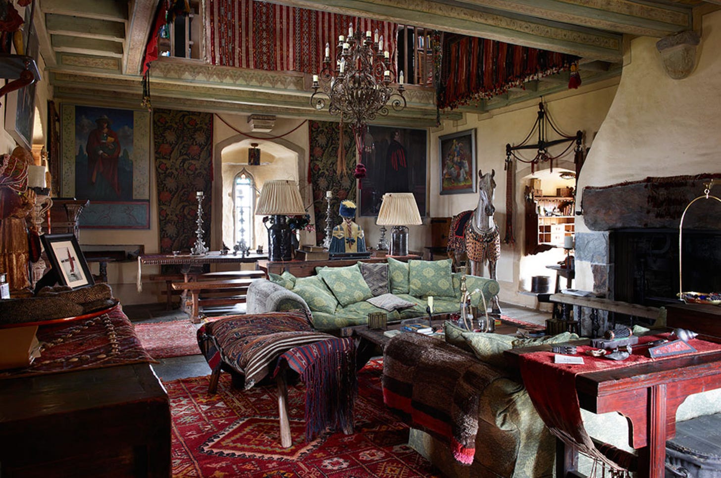The living room of Jeremy Irons castle, with life sized wooden horse.