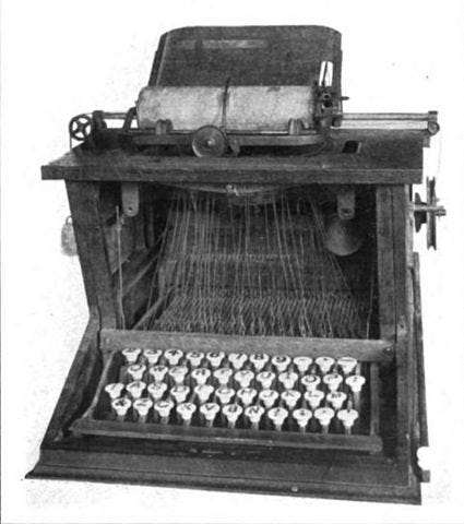 https://upload.wikimedia.org/wikipedia/commons/thumb/9/9a/Sholes_typewriter.jpg/425px-Sholes_typewriter.jpg