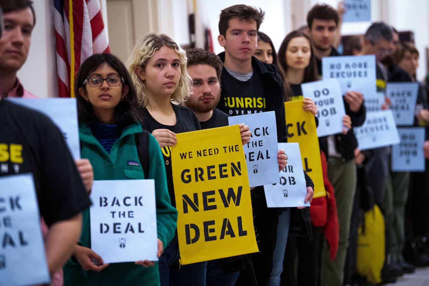 WASHINGTON, DC, UNITED STATES - 2018/12/10: Protesters seen holding placards during the Sunrise Movement protest inside the office of US Representative Nancy Pelosi (D-CA) to advocate that Democrats support the Green New Deal, at the US Capitol in Washington, DC. (Photo by Michael Brochstein/SOPA Images/LightRocket via Getty Images)