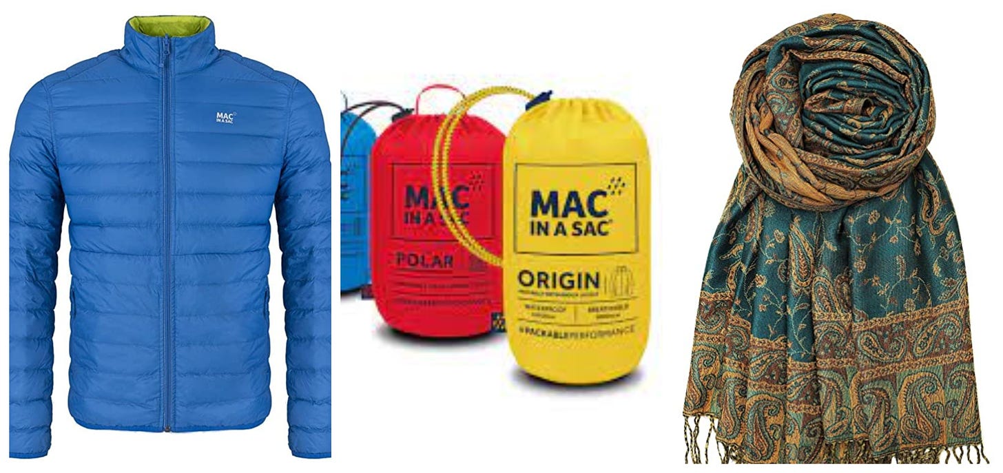 A blue polar fleece Mac in a Sac, Mac in a Sac rain jackets in their sack, and a pashmina scarf. 