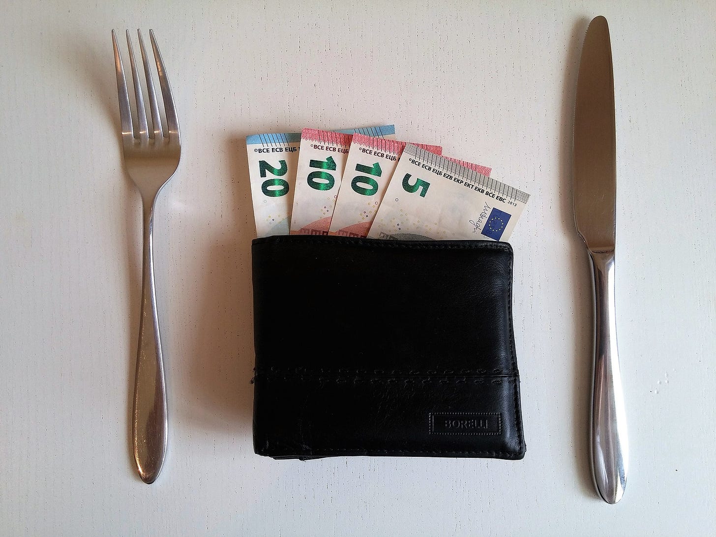 Euros in a wallet on a table