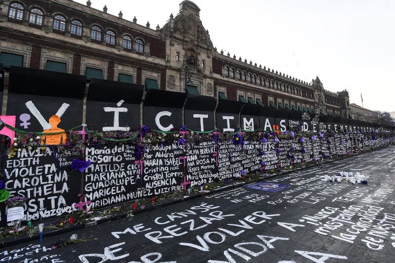 Names of femicide victims, slogans and flowers on the barricade outside Palacio Nacional ahead of International Women’s Day demonstrations Photographer: Karen Melo/Getty Images
