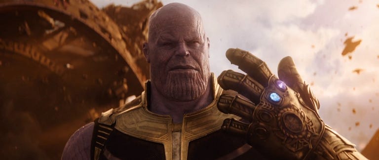 Thanos in Infinity War holding up his hand wearing the gauntlet