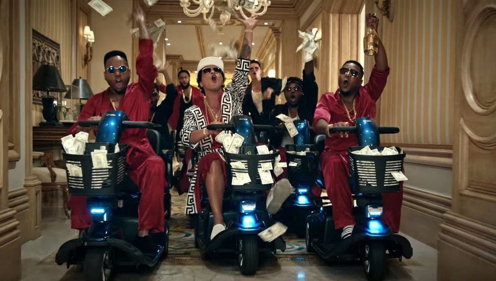 Bruno’s coming for all your money and your mopeds, Macklemore.