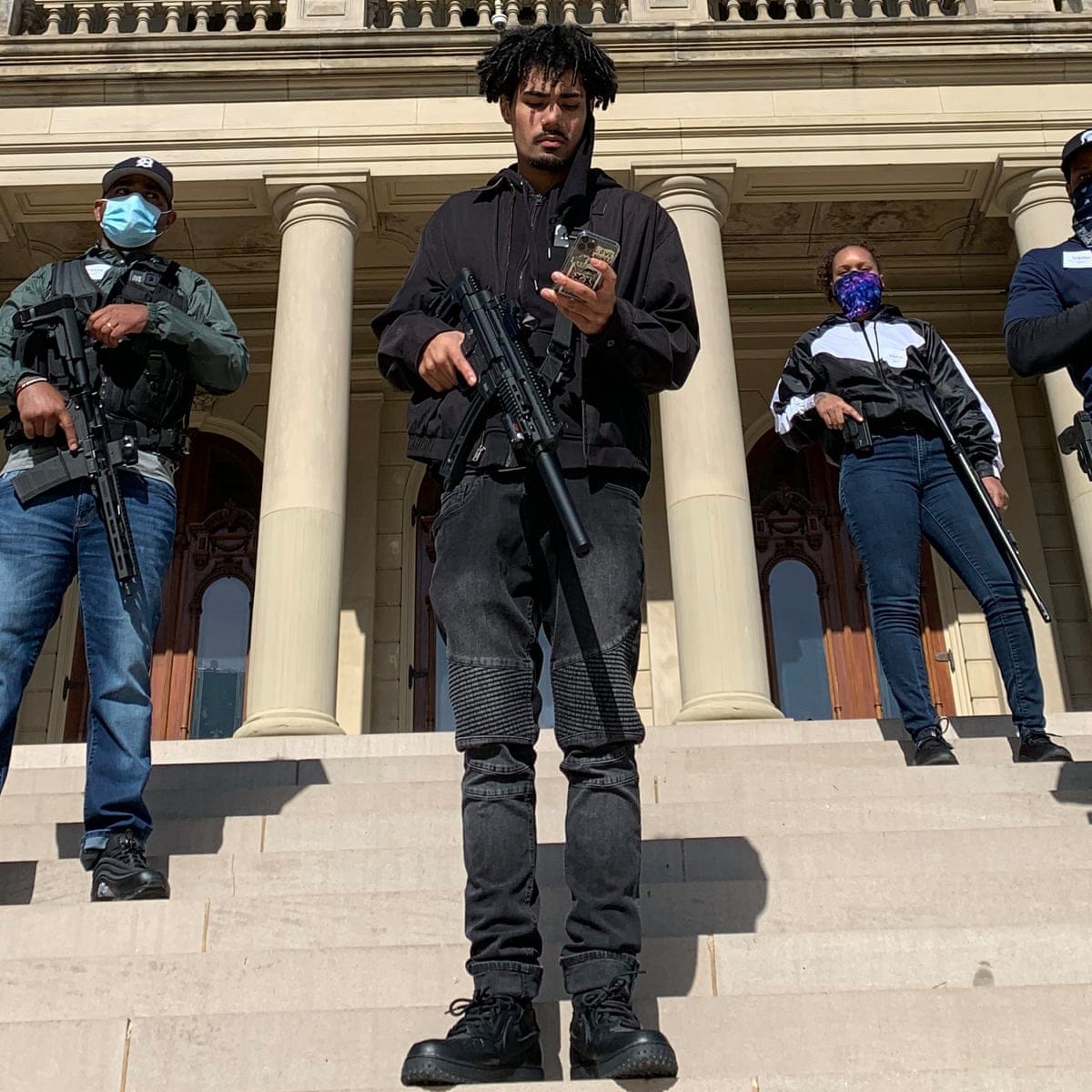 Armed black citizens escort Michigan lawmaker to capitol after ...