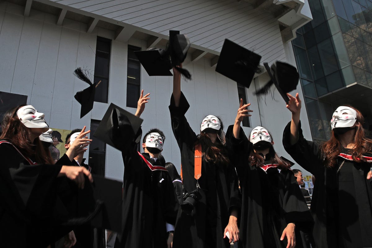 Image result from https://www.aljazeera.com/indepth/inpictures/pictures-masked-students-protest-hk-graduation-ceremony-191107071209928.html