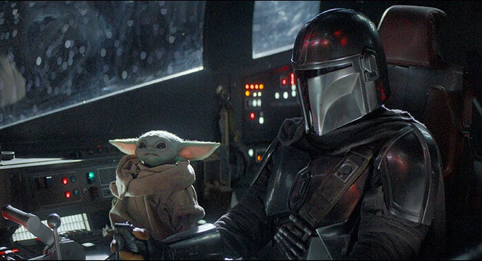 the mandolorian and baby yoda flying their spaceship