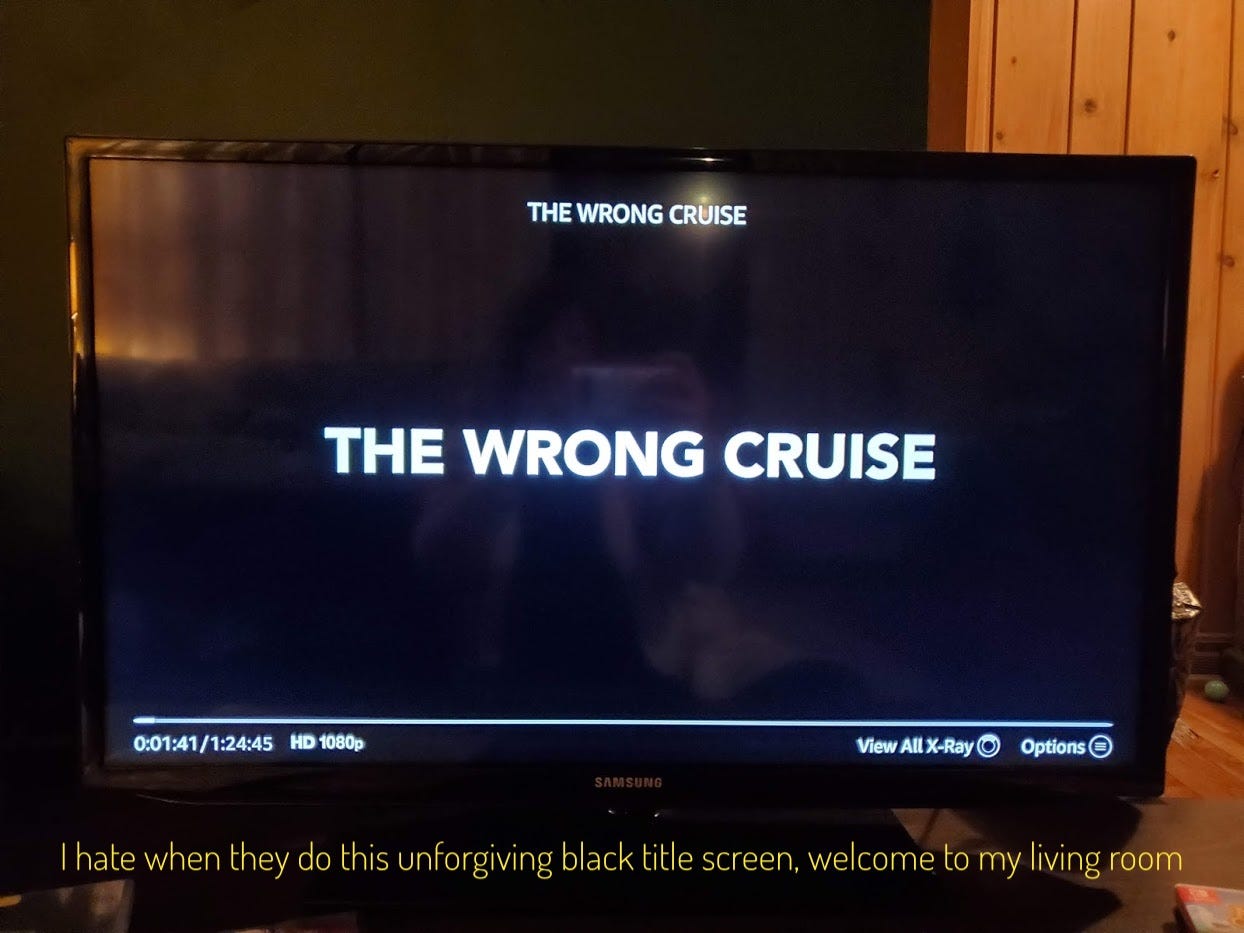 A black screen reading: "The Wrong Cruise." Captioned: "I hate when they do this unforgiving black title screen, welcome to my living room."