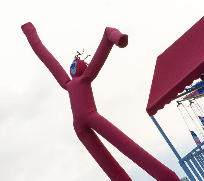 "Wacky Waving Arm Flailing inflatable tube man" by m01229 is licensed under CC BY-SA 2.0.