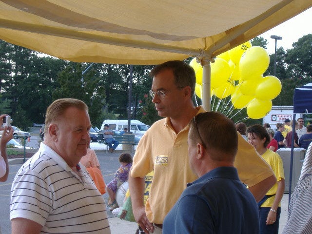 Congressional candidate Andy Harris (center, in yellow) talks issues with interested voters at the Delmarva Shorebirds game, July 25, 2008.