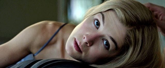 Rosamund Pike in Gone Girl, looking up at the camera