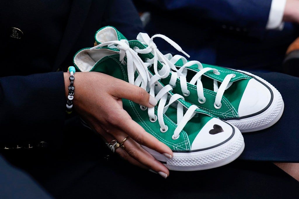 Camila Alves McConaughey holds the green Converse sneakers that were worn by Uvalde shooting victim Maite Yuleana Rodriguez.