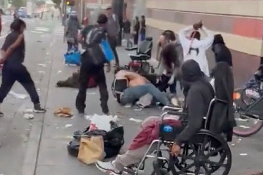 Two homeless men wrestle on the ground, while a third whacks one of them with a broom.