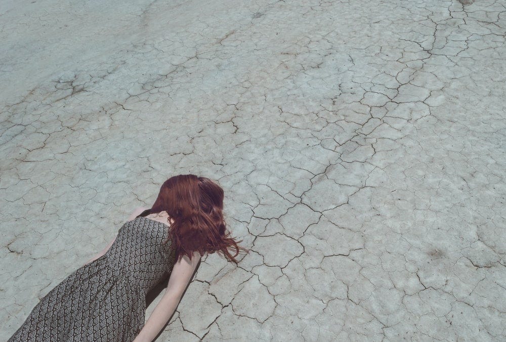 woman lying on ground