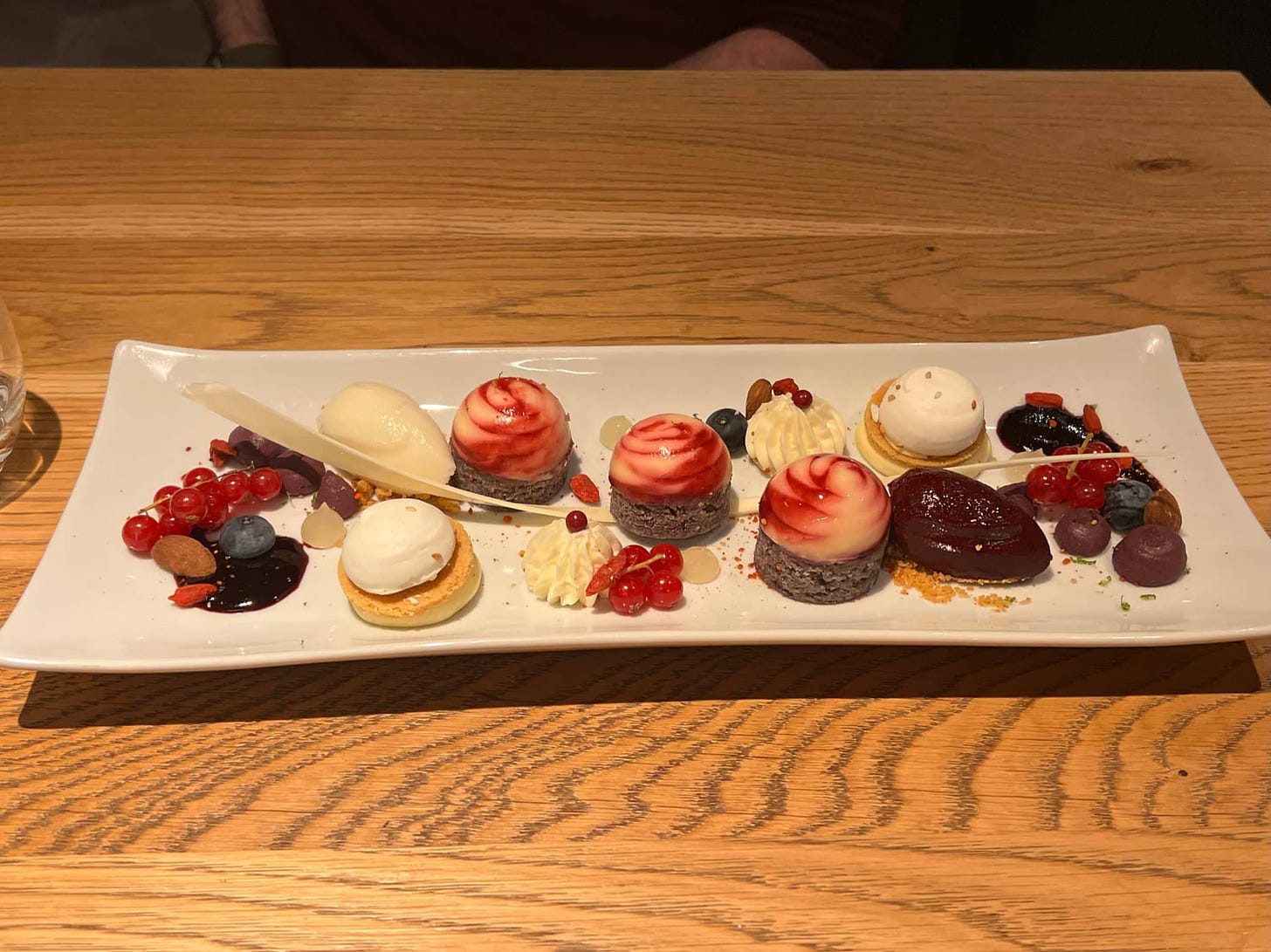A dessert plate with miniature sweets of some sort.
