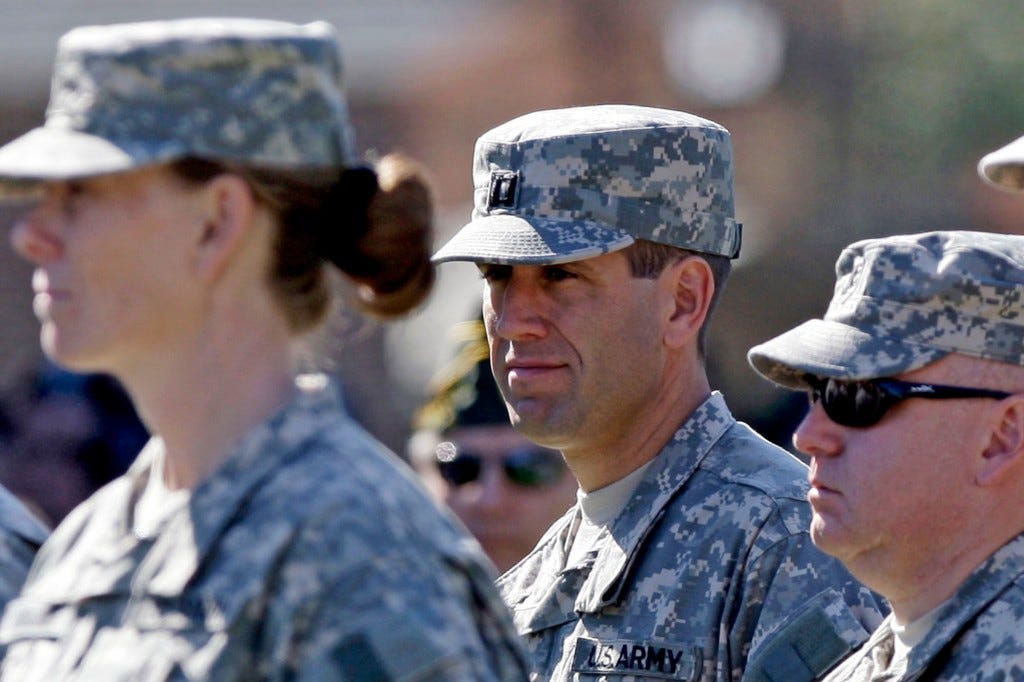 Beau Biden, center, pictured in 2008 with other members of the Delaware Army National Guard unit.
