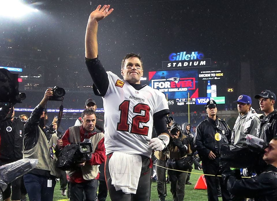 Tom Brady waves to the crowd at Gillette Stadium after the Bucs beat the Patriots in October.