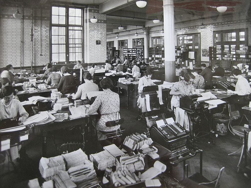 File:Blythe House preparing totals for daily balance 1930s.JPG