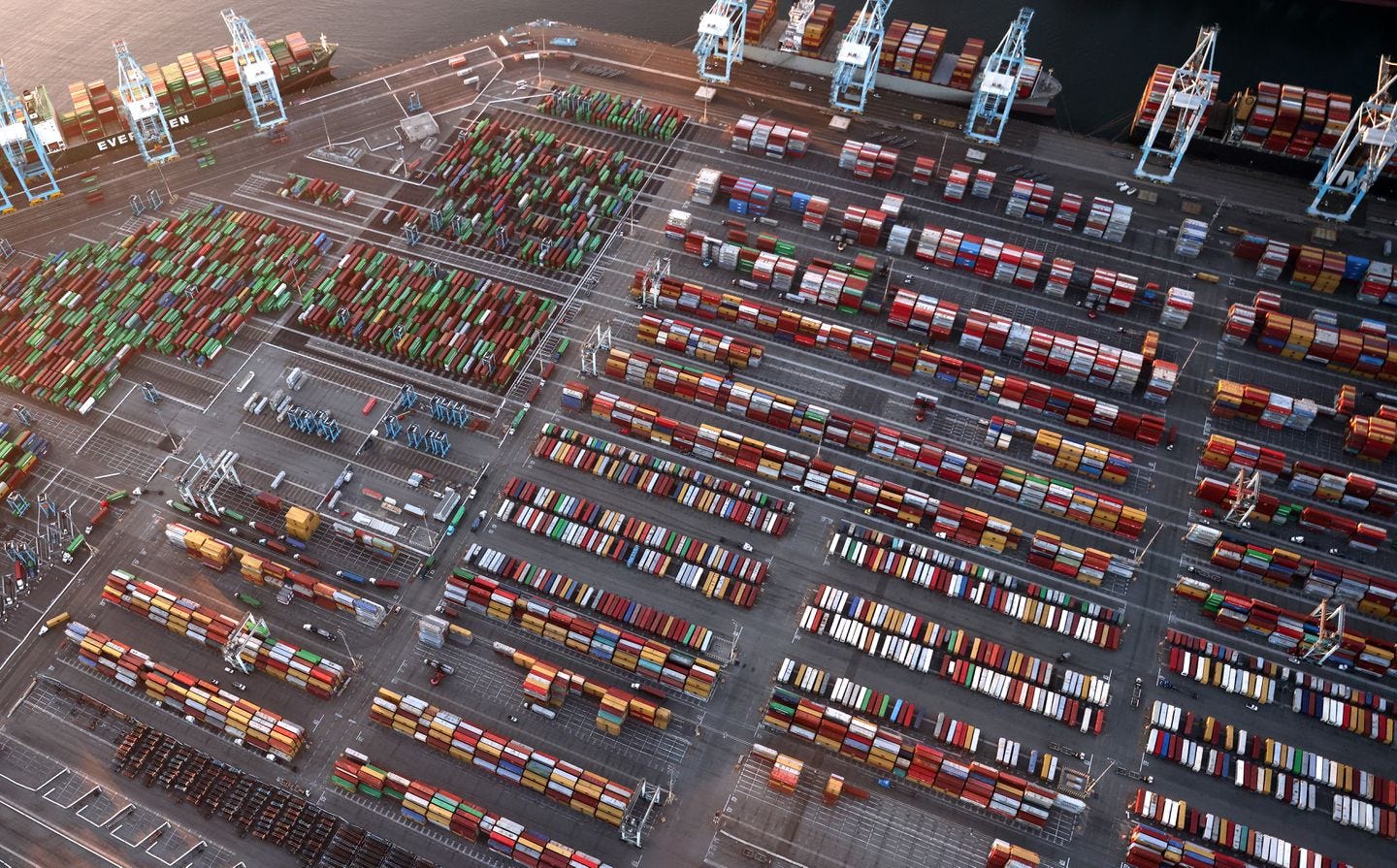 In an aerial view, container ships and shipping containers are seen at the Port of Los Angeles on Sept. 20, 2021 near Los Angeles, California.