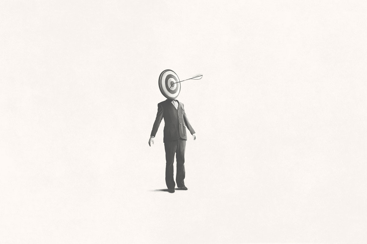 Dialogue with a Divider; Man in Suit with Target for Head and Arrow in Bullseye