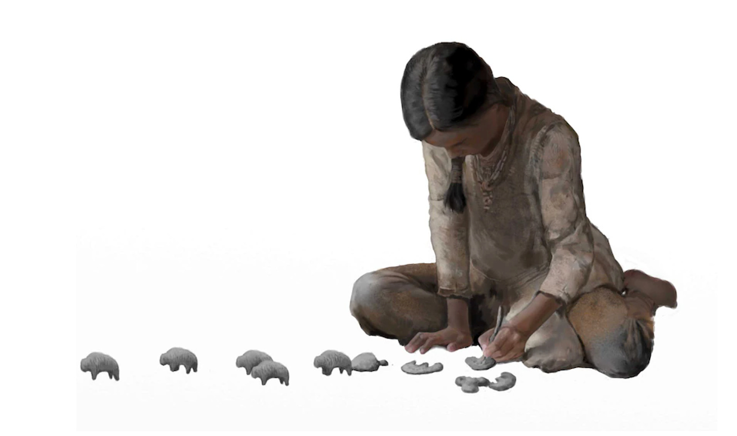 Ilustración en la que se representa a una niña de la prehistoria jugando con pequeños bisontes de piedra