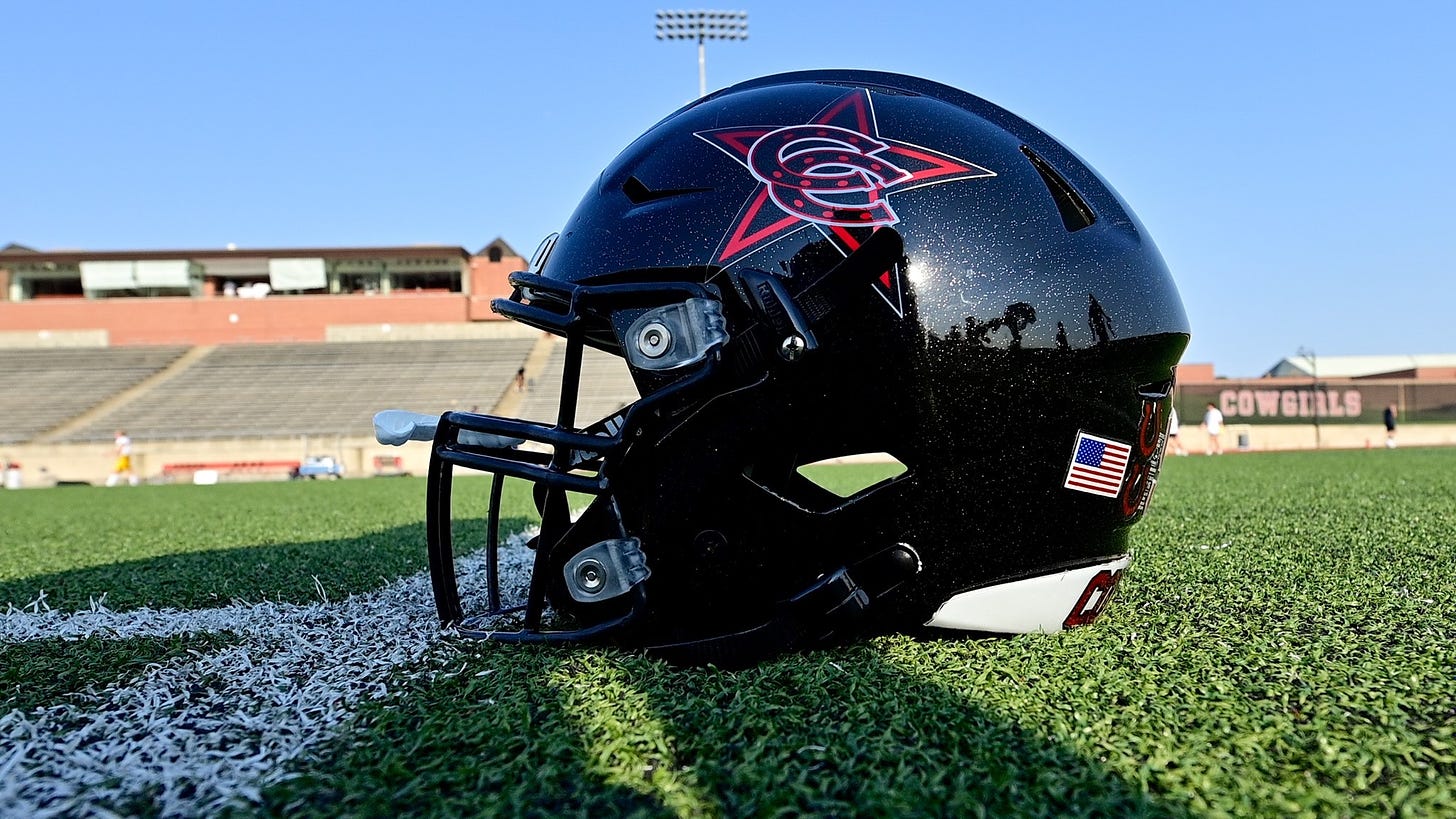A Coppell Cowboys football helmet on the turf at Buddy Echols Field