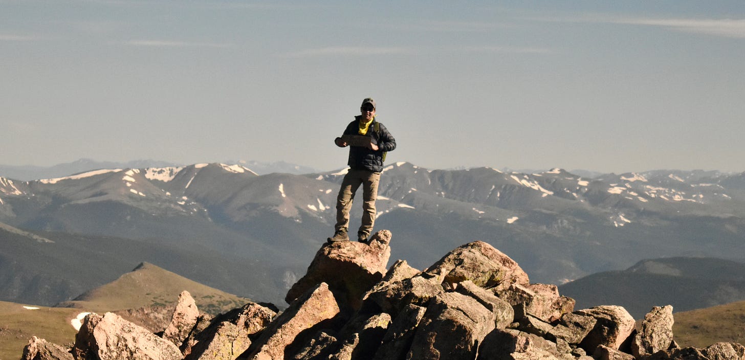 me, standing on the summit of Bierstadt with mountains in the background