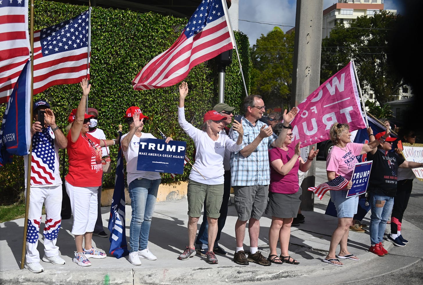 Supporters line the street as US president Donald Trump departs in West Palm Beach, Florida on December 31, 2020, as he travels back to Washington, DC after his Christmas holiday break in Mar-a-Lago. (Photo by ANDREW CABALLERO-REYNOLDS / AFP) (Photo by ANDREW CABALLERO-REYNOLDS/AFP via Getty Images)