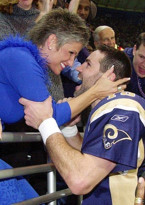 Kurt Warner frequently celebrated with his wife Brenda after big NFL games. The couple embrace following the January 2002 NFC Championship game against the Philadelphia Eagles.