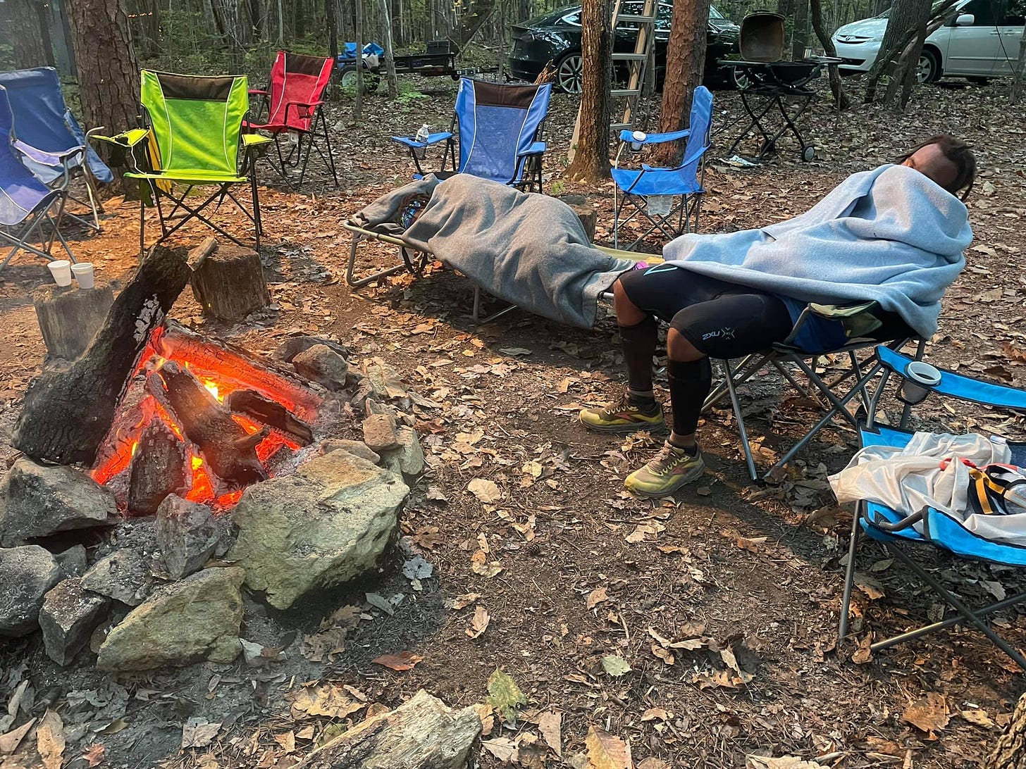 May be an image of one or more people, people camping, people sitting and outdoors