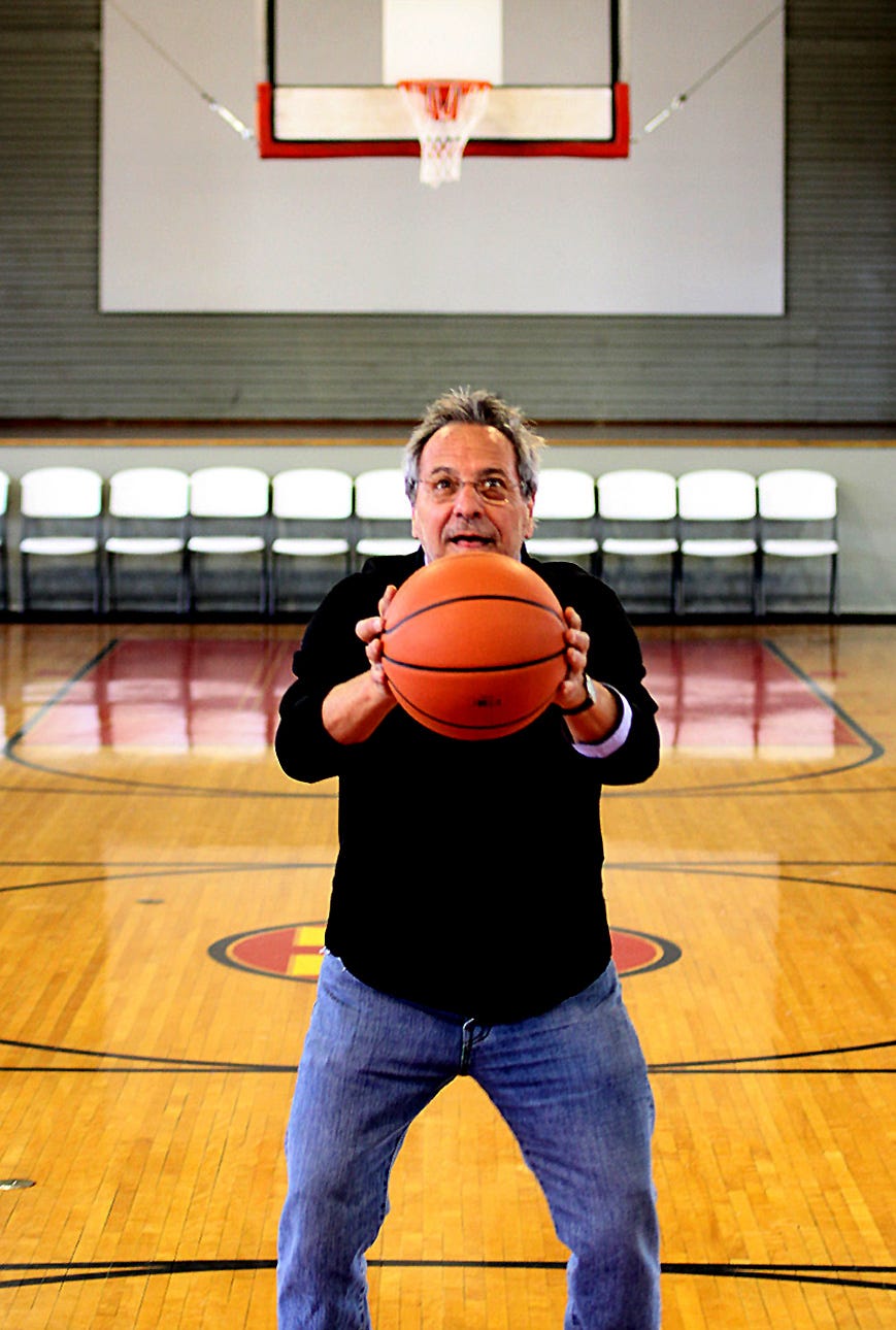 Hoosiers Director David Anspaugh tries an “Ollie” free throw at the Hoosier Gym in Knightstown. The century-old gymnasium, once home to the Knightstown High School Panthers, served as Hickory Huskers’ home court in the beloved 1986 film. Anspaugh and a small entourage stopped by the Hoosier Gym in March 2013.