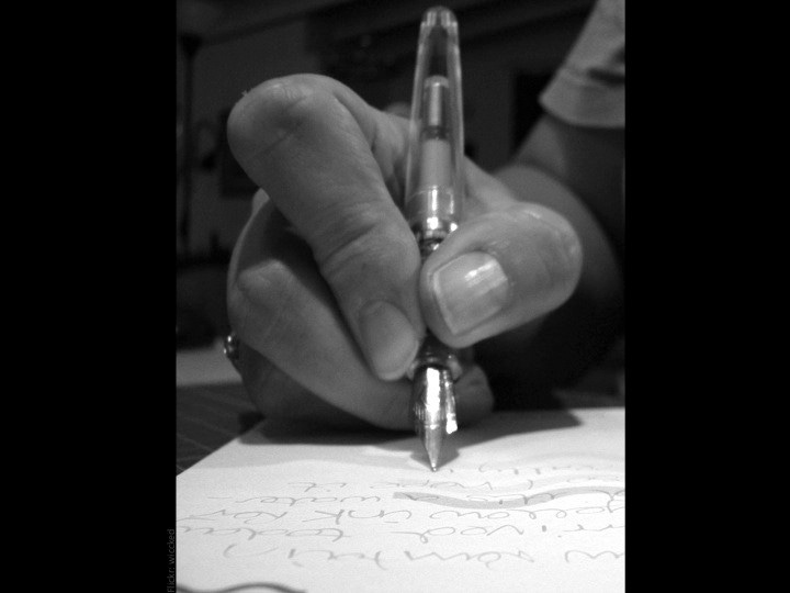 Close up female hand writing