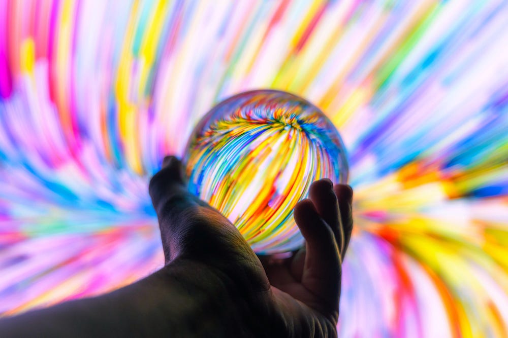 Glass ball reflecting rainbow light