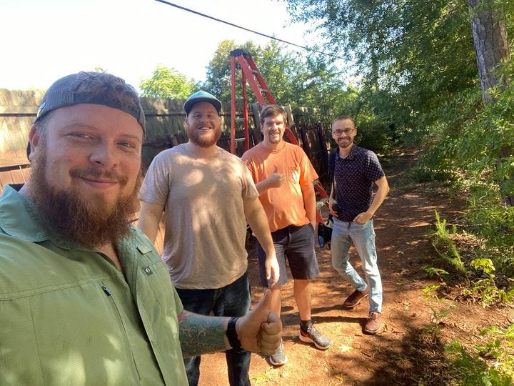 May be an image of 4 people, beard, people standing and outdoors