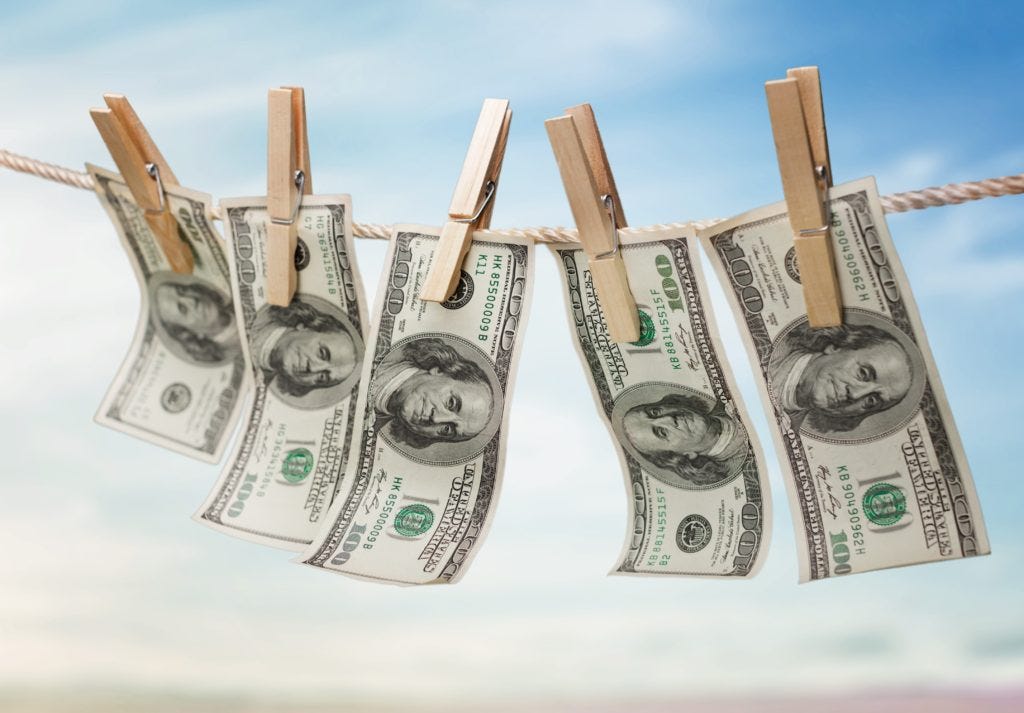 Picture of $100 bills on a clothesline