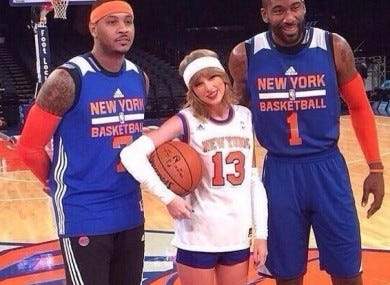 Taylor Swift shows her support for the Knicks and hangs out with a  less-than impressed Carmelo