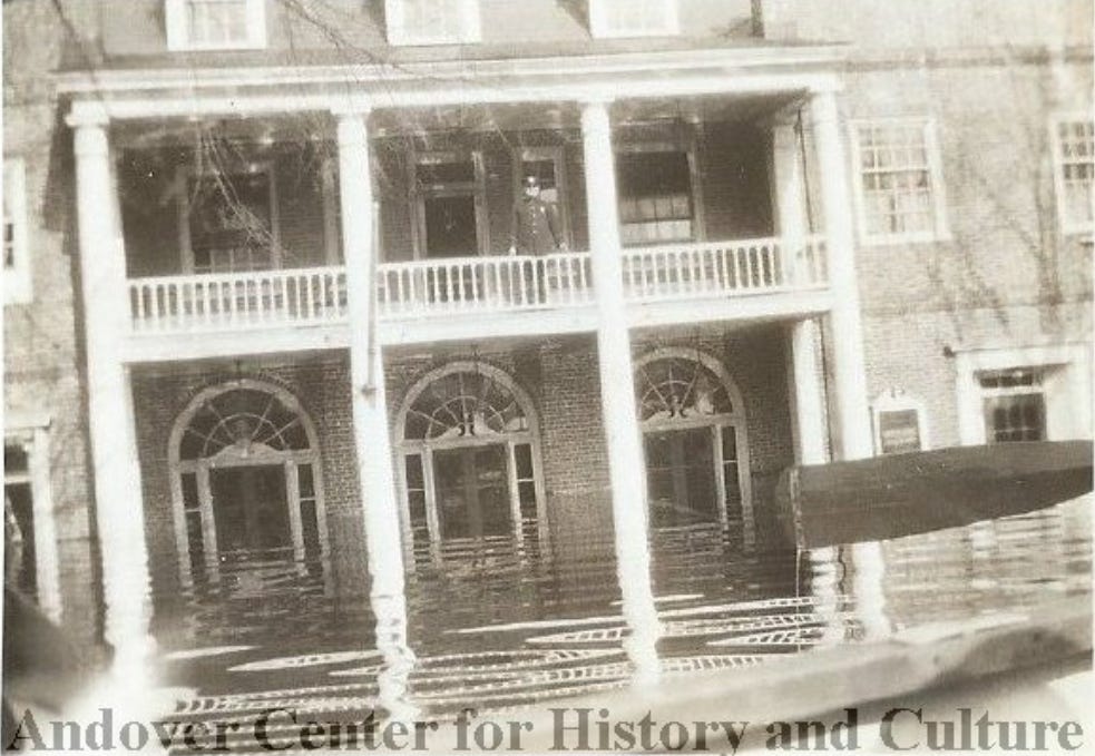 Flooded building with columns and arched windows 