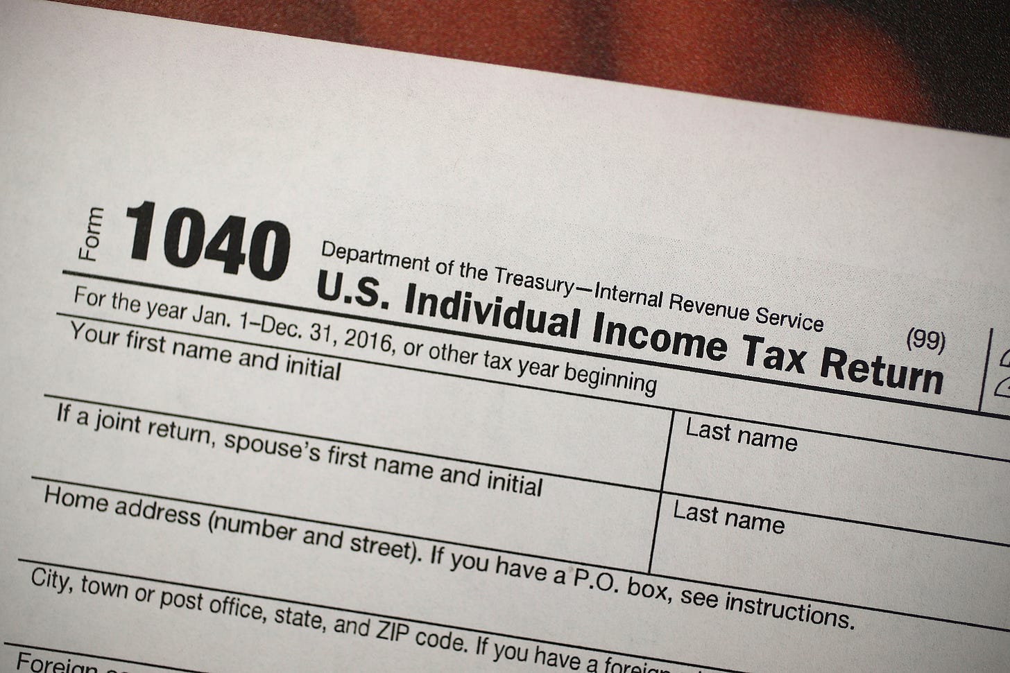 A copy of a IRS 1040 tax form is seen at an H&R Block office on the day President Donald Trump signed the Republican tax cut bill in Washington, DC on December 22, 2017 in Miami, Florida