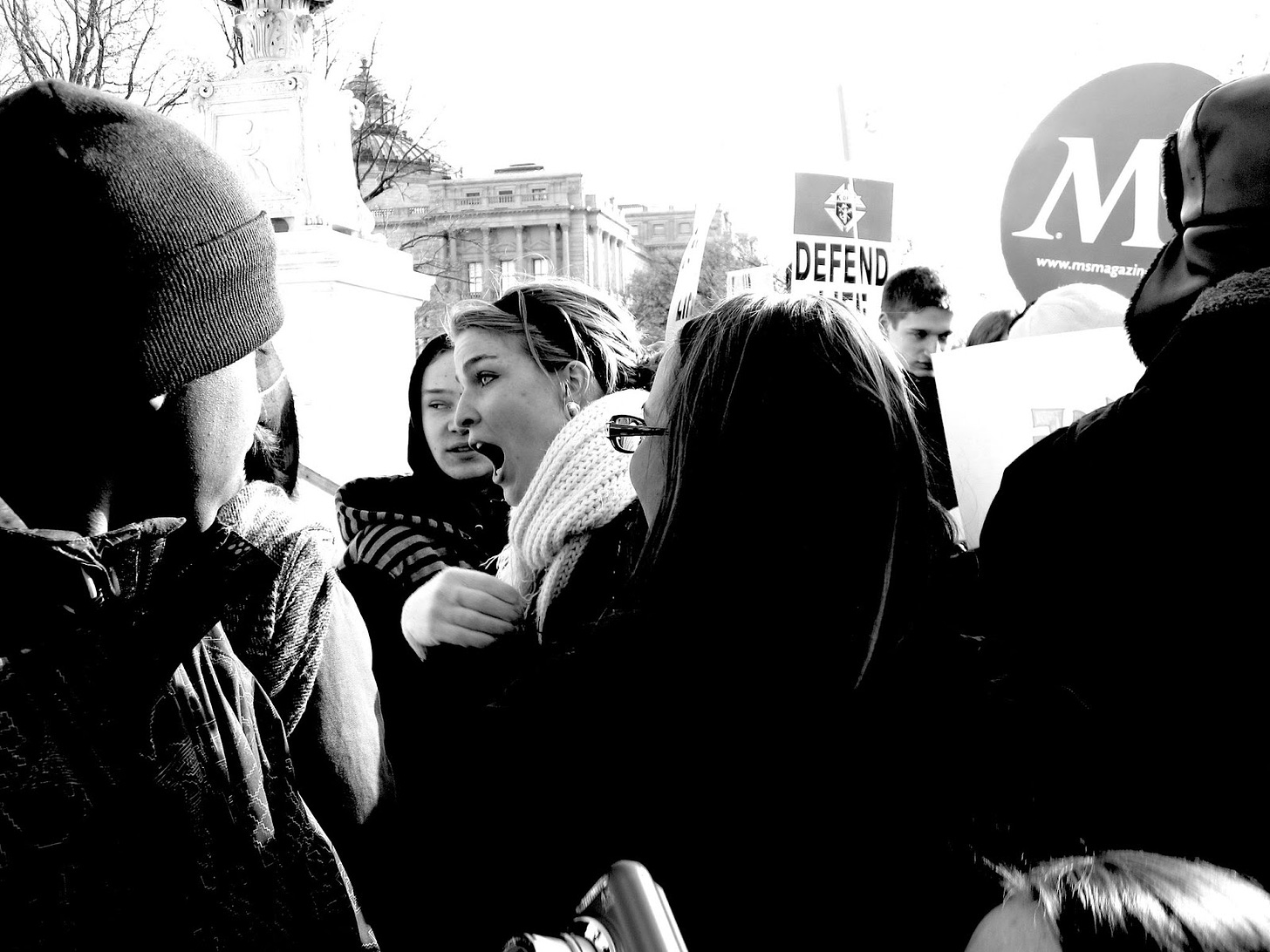 pro-choice woman argues with pro-life person