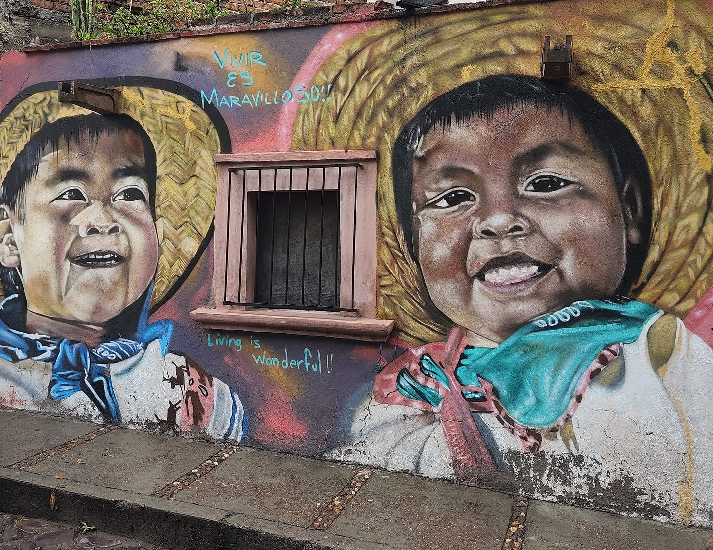 A street mural of two Mexican children